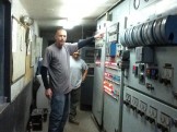 Worker Pointing at Controls